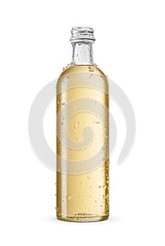 Chilled transparent glass yellow soda bottle with droplets and ice crystals isolated on a white