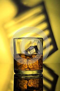 Chilled Whiskey Glass with fizzy soda and Ice Cubes