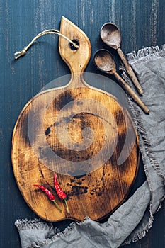 Chilli pepper on cutting board. Space for text.