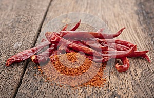 Chilli powder  and  dried red pepper on white background