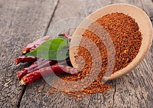 Chilli powder  and  dried red pepper on white background