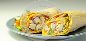 Chilli tortilla wrap with chicken breast, peppers, cucumber and mix salad