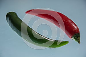 Chillies, different types and colors in the foreground