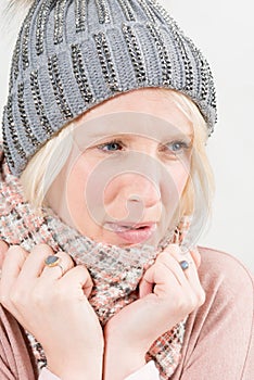 Chilling Blonde Woman Wearing Scarf and Winter Beanie