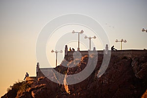 Chilling on a wall in Mazatlan watching the sunset