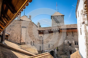 Chillon castle interior courtyard wide angle view with tower taken from wall walk in Switzerland