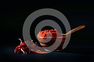 Chilly powder with red chilly in white plate