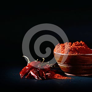 Chilly powder with red chilly in white plate