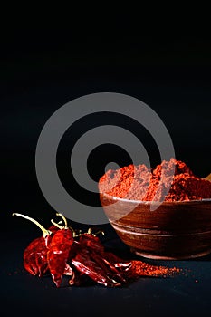 Chilly powder with red chilly in white plate