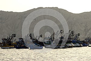 Chimbote, Peru Trawlers and boats moored at Chimbote, Peru with white mountain in background