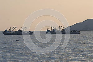 Chimbote, Peru -Trawlers and boats moored at Chimbote, Peru with white mountain in background