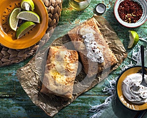 Chimichanga with lime, cream, chilly and beer