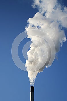 Chimney billowing white smoke