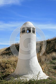 Chimney of cave-house near Guadix, Andalusia photo