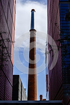 Chimney in the courtyard of the former ca Aranyo cotton factory, today headquarters of the Pompeu Fabra University of Barcelona