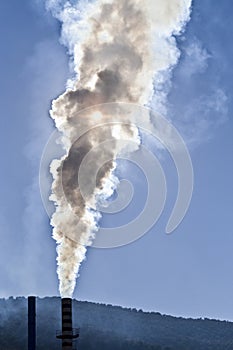 Chimney expelling pollutant gases to the air