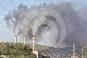 Chimney expelling pollutant gases to the air