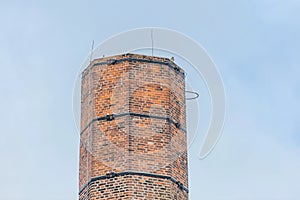 Chimney made of red bricks and blue sky