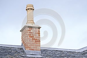 Chimney pot on old victorian house roof building uk