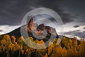 Chimney Rock and aspen trees at sunset, Colorado, USA