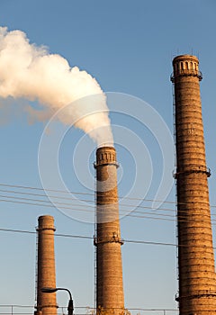 Chimney smoke with blue sky