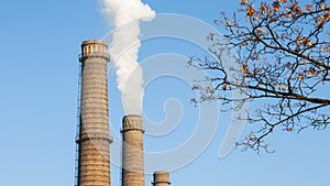 Chimney smoke with blue sky