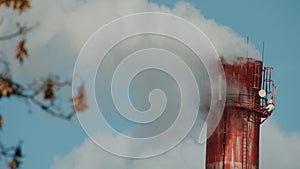 Chimney, smoke, industry - Red big chimney pipe emits white smoke substance, blue sky backdrop, daytime, environmental