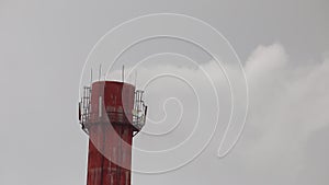 Chimney, smoke, industry - Red big chimney pipe emits white smoke substance, grey sky backdrop, daytime, environmental