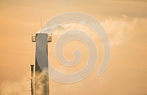 Chimney with the smoke on sunset, earth pollution