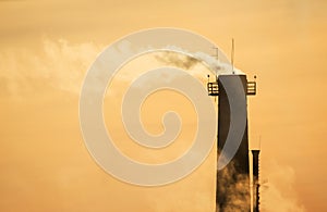 Chimney with the smoke on sunset, earth pollution