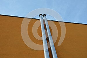 Chimney for solid fuels or gas boiler with inspection and cleaning shaft. stainless steel insulated chimneys running along the ora