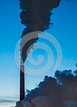 Chimney stack smoke vapour all reaching for the sky