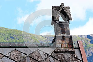 Chimney on a stone church roof, Norway