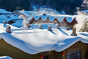 The chimney on thel snow on the houses