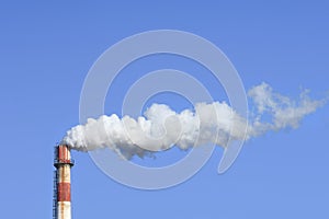 Chimney with withe Smokestack against a blue sky, Beijing, China