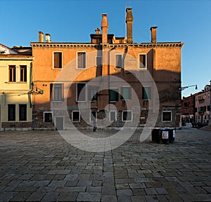 Chimneys and fireplaces of old Venice. Evening in the city. Italy