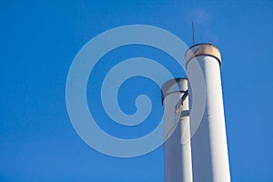 Chimneys in front of blue sky