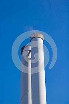 Chimneys in front of blue sky