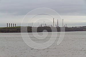 Chimneys of power station and oil refinery, landscape