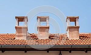 Chimneys on the roof with shingles