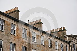 Chimneys of traditional tenement building in UK