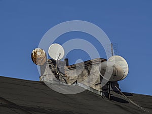 Chimneys and TV antennas in the old building