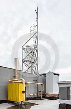 Chimneys, ventilation system and lightning protection of an industrial gas boiler on the roof of a building