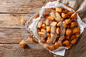 Chin chin is a fried snack in West Africa, mostly in Nigeria served in a plate on a close-up. Horizontal top view