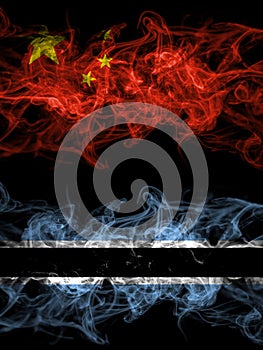 China, Chinese vs Botswana, Batswana smoky mystic flags placed side by side. Thick colored silky abstract smoke flags