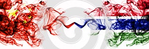 China, Chinese vs Gambia, Gambian smoky mystic states flags placed side by side. Concept and idea thick colored silky abstract