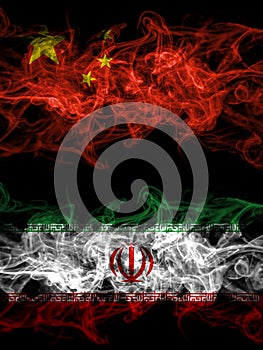 China, Chinese vs Iran, Iranian smoky mystic flags placed side by side. Thick colored silky abstract smoke flags