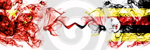 China, Chinese vs Uganda, Ugandan smoky mystic states flags placed side by side. Concept and idea thick colored silky abstract