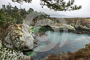 China Cove, Beach in Point Lobos State Natural Reserve, with rock and geological formations along the rugged Big Sur coastline,