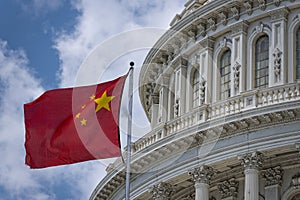 China flag waving on Washington DC Capitol dome detail